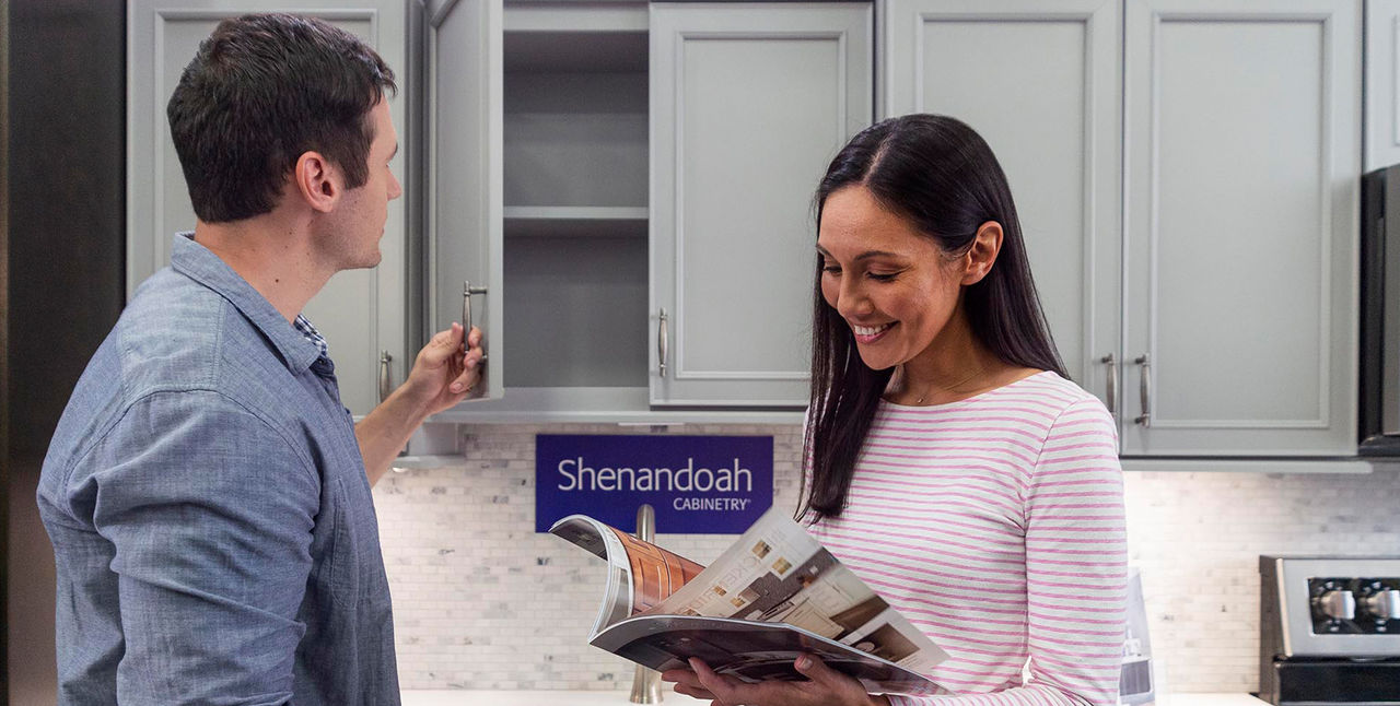 Customers looking at cabinet